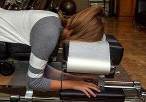 Person on chiropractic adjustment table
