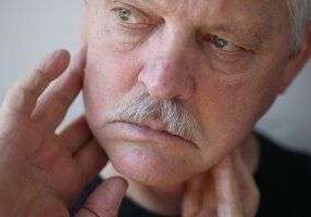 Pensive man with mustache close-up