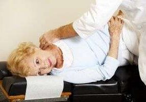 Chiropractic adjustment on an elderly woman