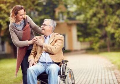 Caregiver and senior outdoors