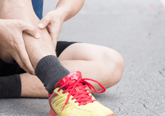 Person sitting with leg injury