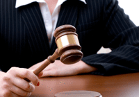 Lawyer with gavel at desk