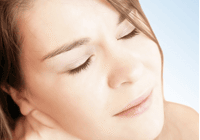 Woman with closed eyes and serene expression